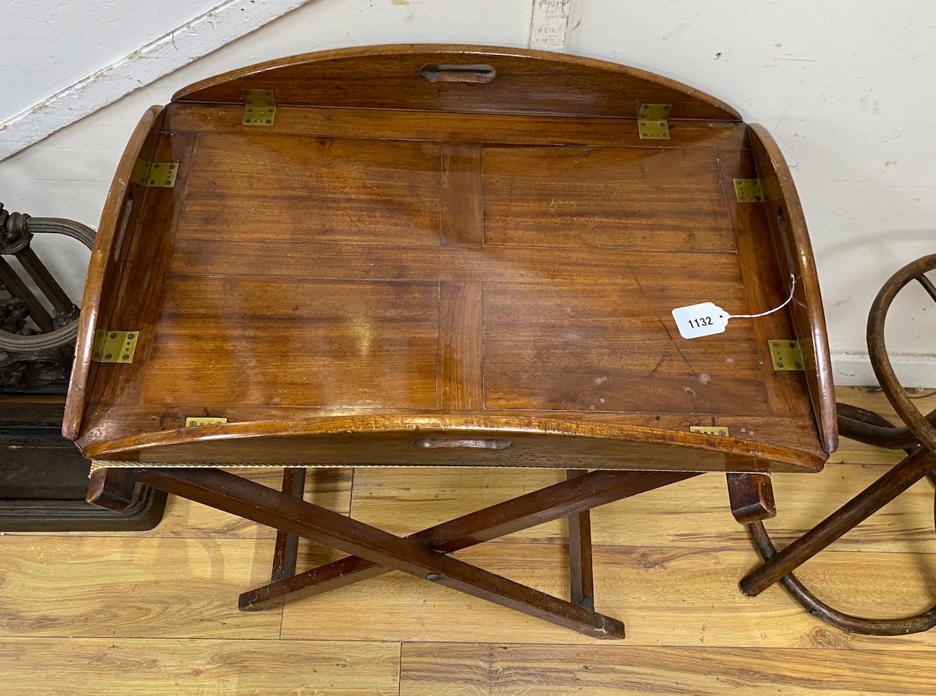 A 19th century mahogany butler’s tray on folding stand, width 68cm, depth 46cm, height 80cm